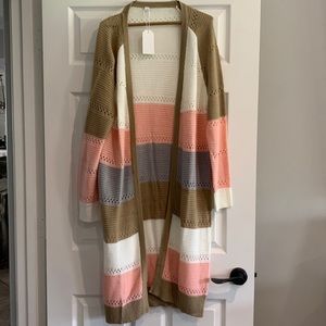 Multi-colored pull on sweater.  Size small.